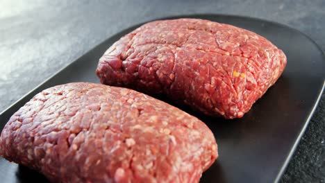 Minced-beef-served-on-black-tray