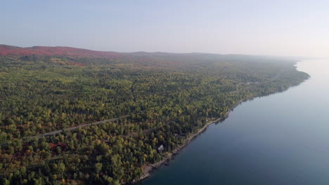 ariel pan of lake superior shoreline on a clear sunny morning