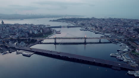 Three-bridges-and-the-gloomy-cityscape-of-Istanbul-in-Turkey-on-a-grey-day,-slow-motion,-copy-space