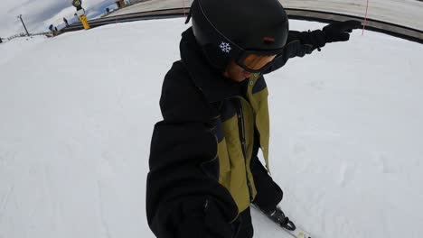 male tourist skiing at the remarkables ski area in queenstown, new zealand during winter