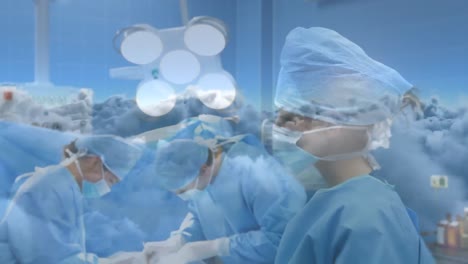 animación del cielo y las nubes sobre los cirujanos que usan máscaras faciales en el hospital