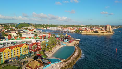 mall and hotel infinity pool overlooking tropical caribbean paradise on beautiful day