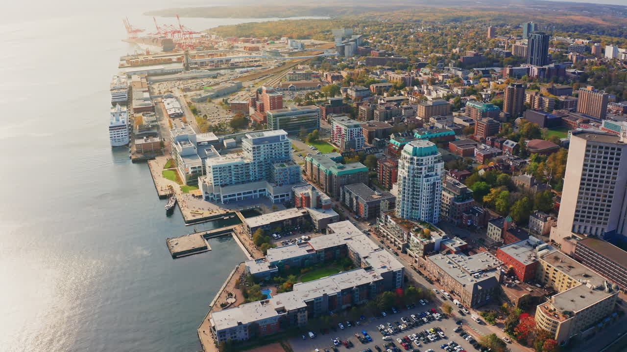 Aerial drone shot over Halifax downtown, Nova Scotia, Canada.
High view of the cityscape, ocean and the urban buildings.