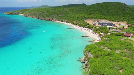 aerial pullback above playa porto mari on beautiful day in caribbean island of curacao