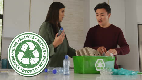 animation of recycle sign over happy diverse couple recycling at home