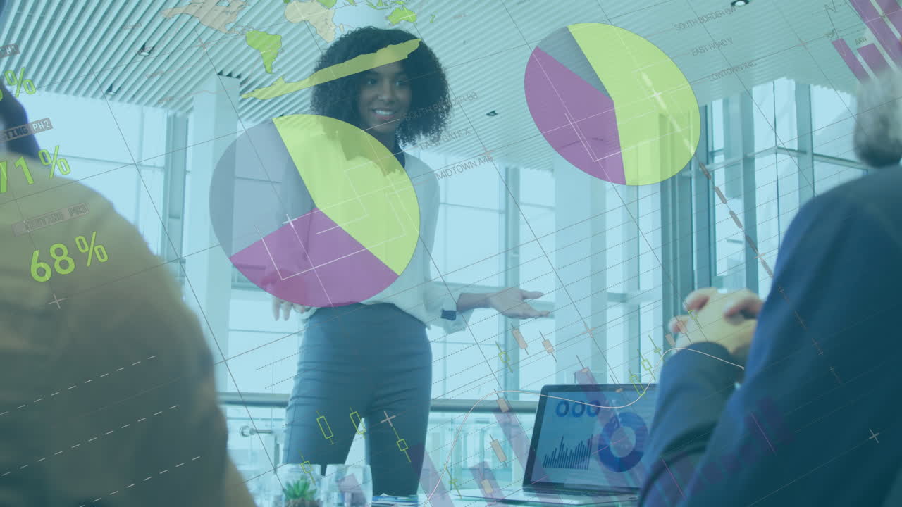 Animation of data processing against african american woman discussing with colleagues at office