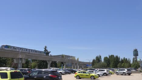 Train-Driving-at-Elevated-Railway-Above-Car-Park-at-Vancouver-Airport