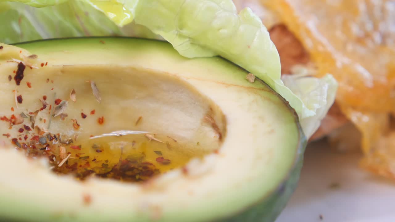 Avocado with spices and oil