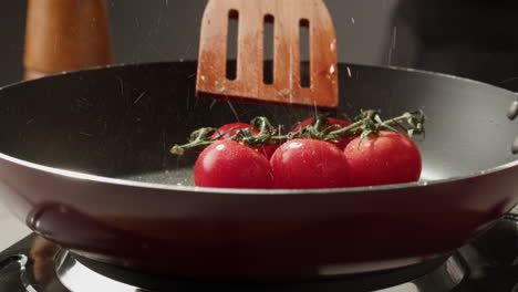 cooking tomatoes in a pan