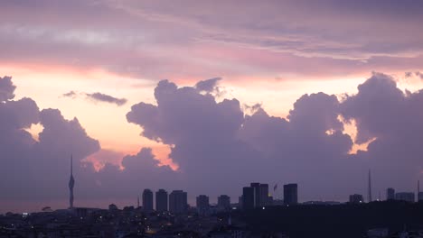 city skyline at sunset with dramatic clouds