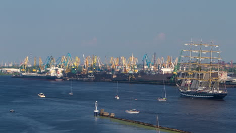 Time-lapse-Sailboat-regata,-industrial-port-background