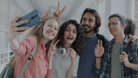 students taking a selfie in a school corridor