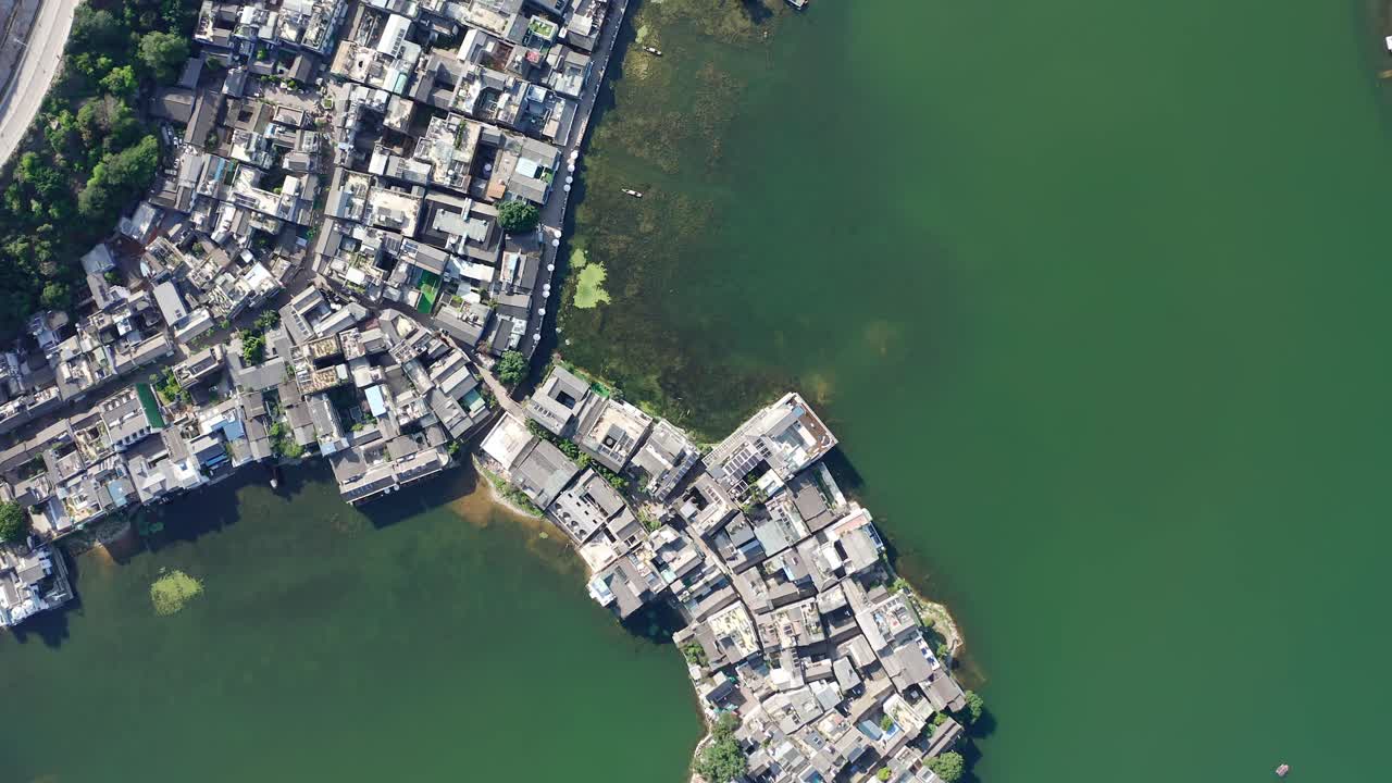 Village and lake in Shuanglang, Yunnan, China.