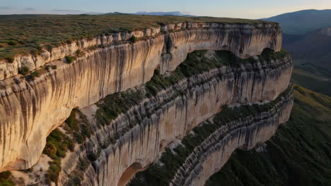 layered cliff face in mountain landscape