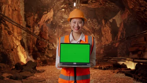 engineer with laptop in a mine