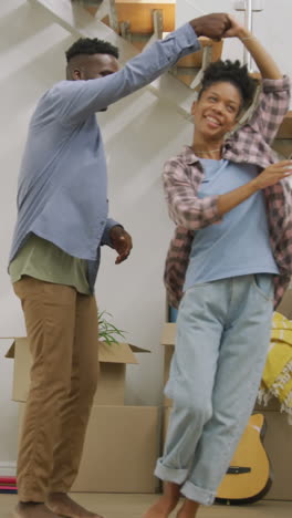 video of happy african american couple embracing after moving into new house