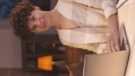 woman working on laptop at night