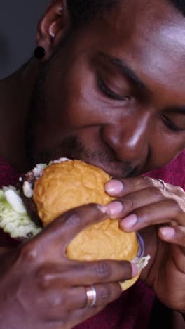 man eating a hamburger