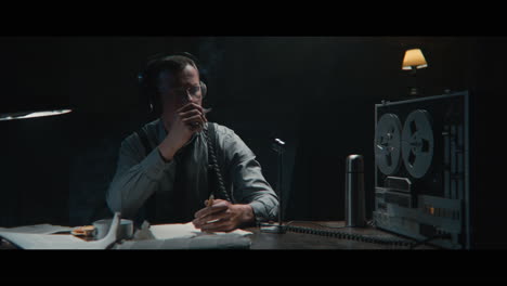 an intelligence officer listens to the wiretap recordings