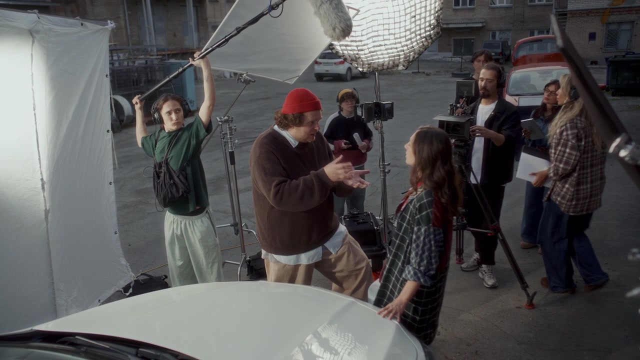 Video Production Crew Filming Actors on Outdoor Movie Set