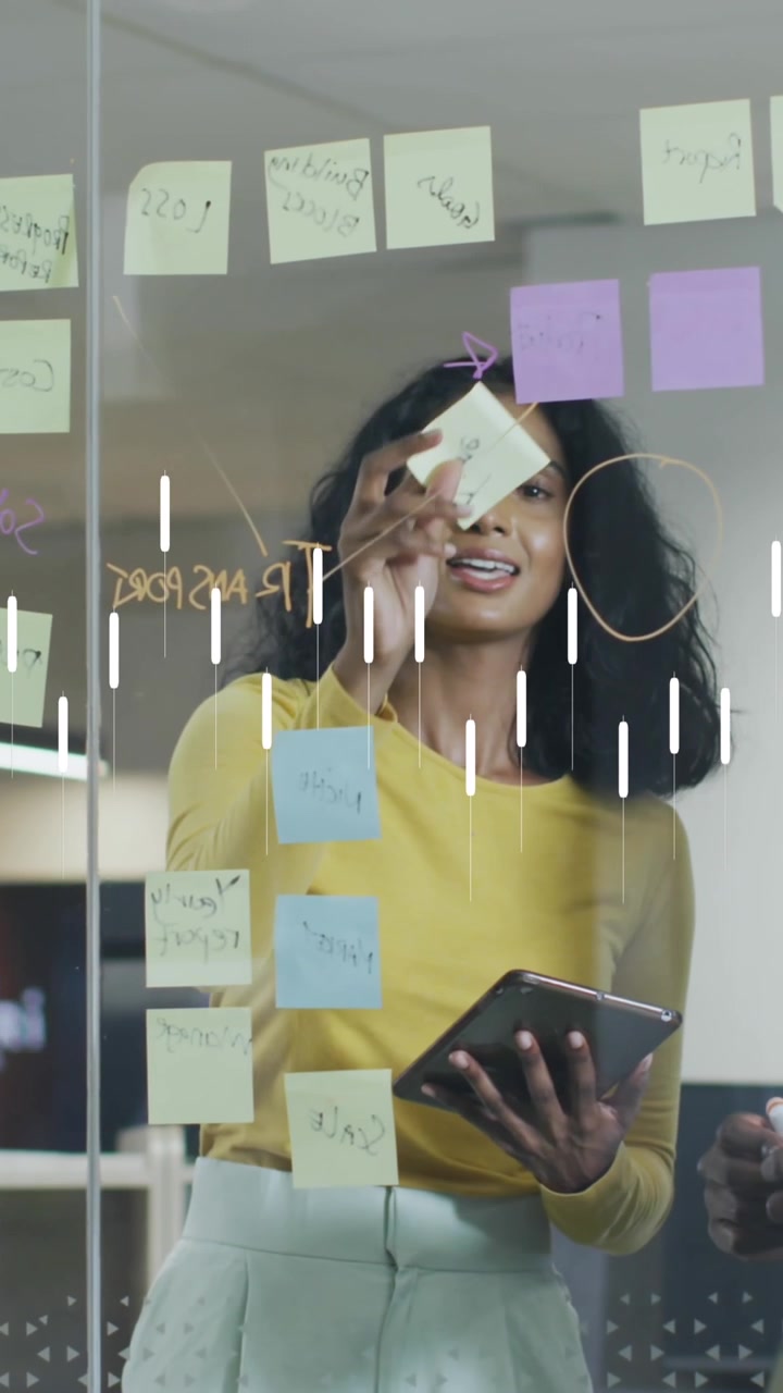 Animation of financial data processing over diverse business people discussing work at office