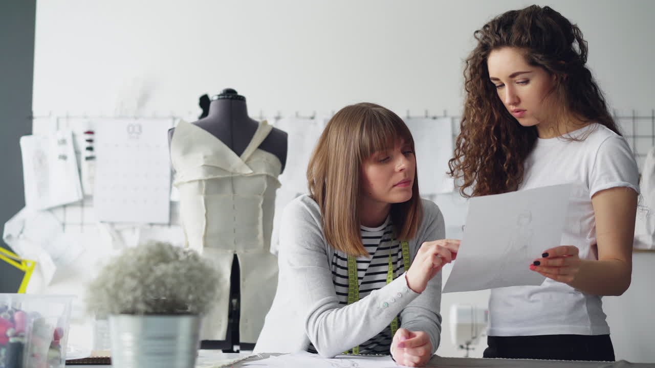 Fashion Designers Collaborating on a Design