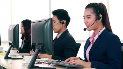 business people wearing headset working in office