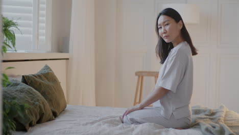 woman in pajamas in bedroom