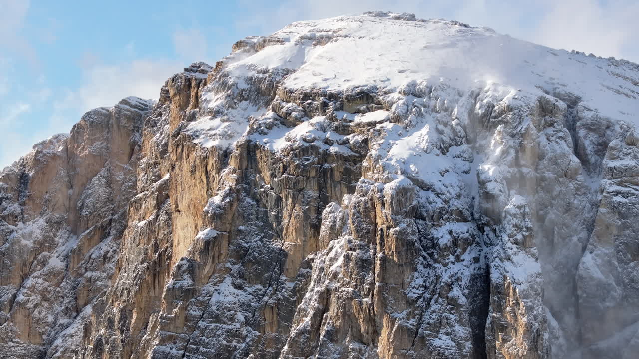 Aerial drone view of snow on the mountains in the Dolomites, Italy
