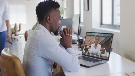 African-american-businessman-using-laptop-for-video-call-with-african-american-business-colleague