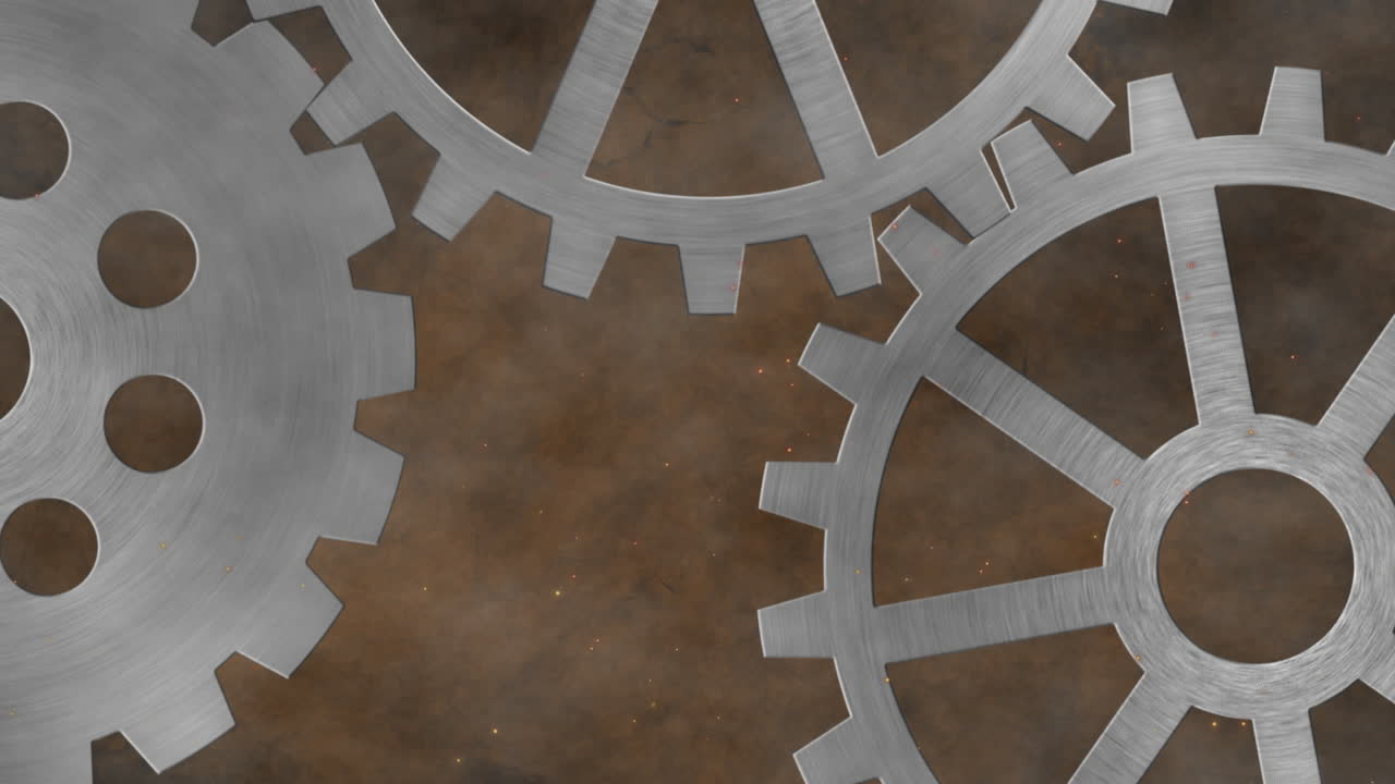 Animation of three grey metallic silver spinning cogs