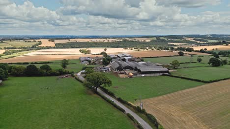 aerial footage of a modern day farm and out buildings in a rural yorkshire landscape, shot in emley village west yorkshire