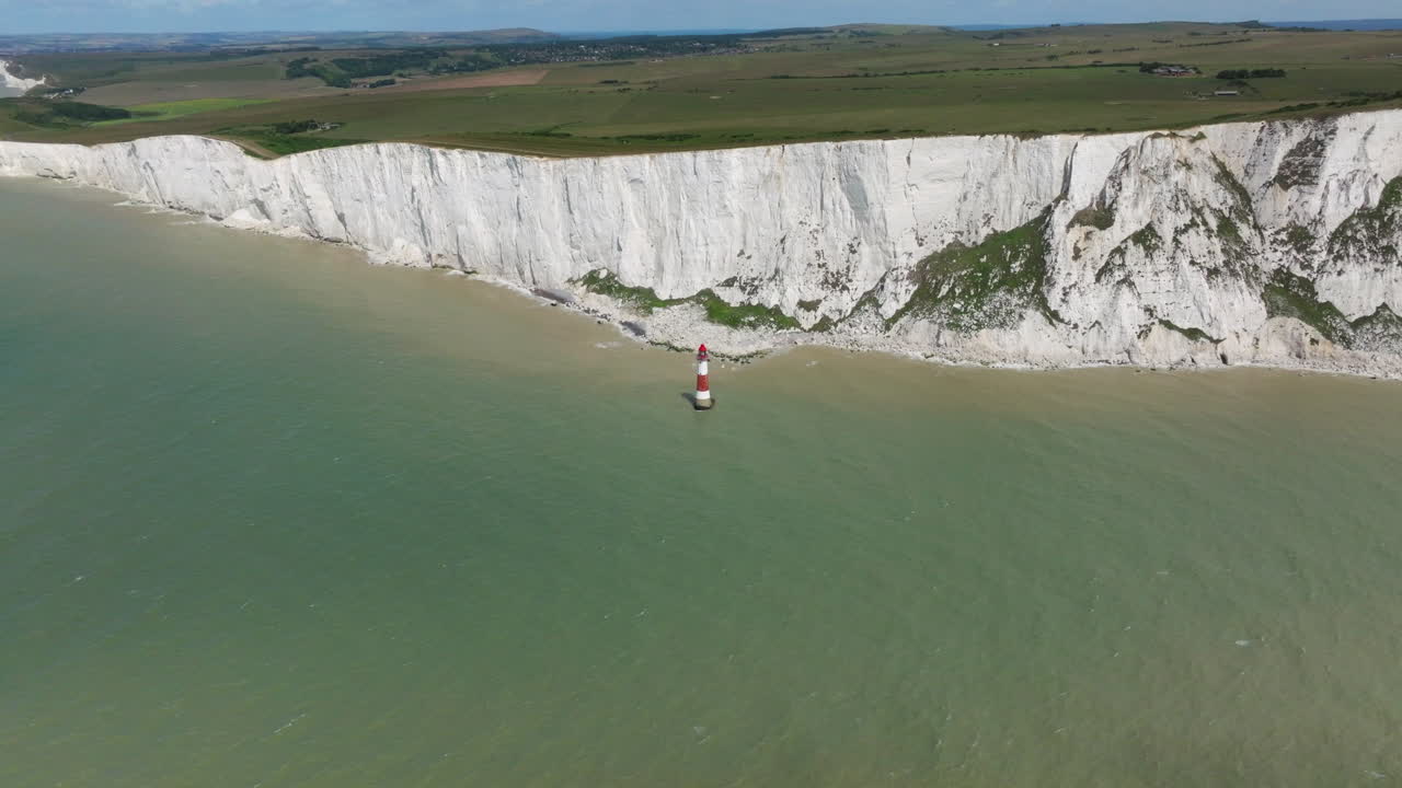 Panorama Of Seven Sisters Cliffs And Beachy Head Lighthouse In The English Channel In Summer In United Kingdom. - aerial shot