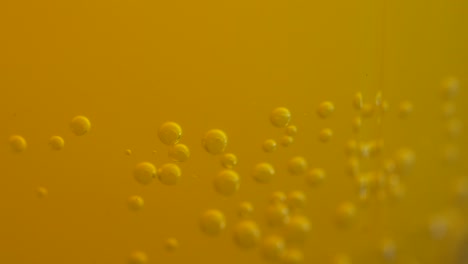 bubbles in a yellow liquid