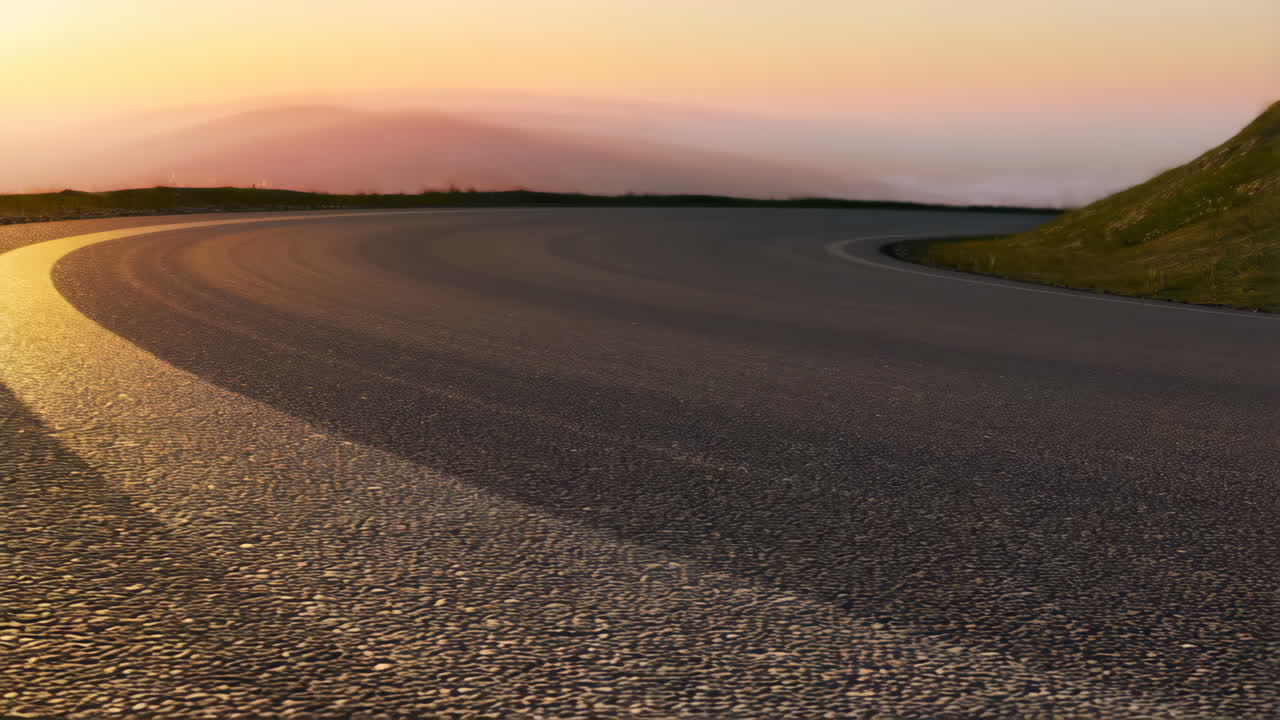Curved Mountain Road at Sunset