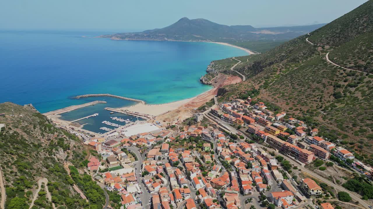 Buggerru mining and coastal village at West Coast of Sardinia, Italy - 4k Aerial