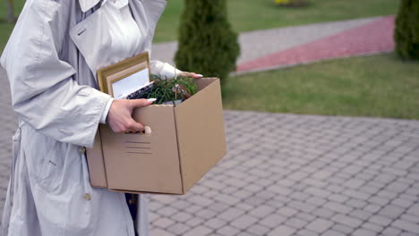 a young woman is walking in front of an office building