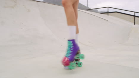 closeup of a woman roller skaters legs skating