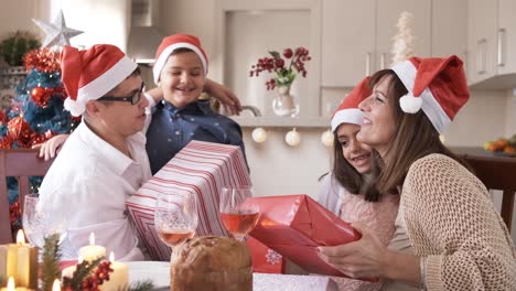 homoparental family celebrating christmas with father christmas hats