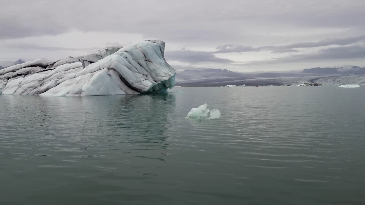 Floating And Melting Ice Near J&ouml;kuls&aacute;rl&oacute;n Glacier Lagoon, Iceland - Drone Shot