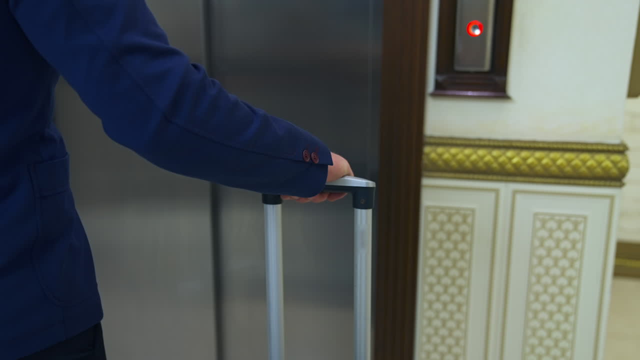 Businessman waiting for elevator. Man waiting for elevator in hotel