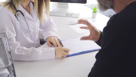 Female-doctor-talking-to-patient-and-patient-telling-something-to-doctor.