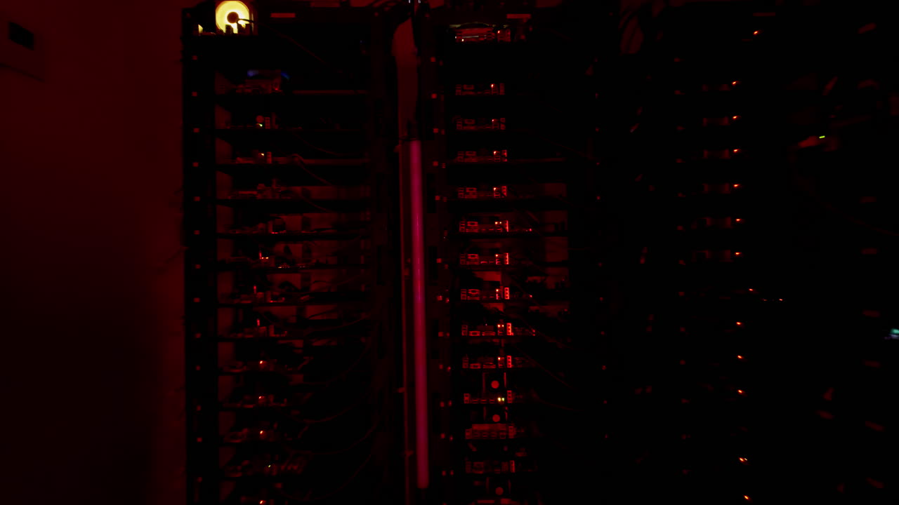 Multiple servers with flashing red lights in a data center