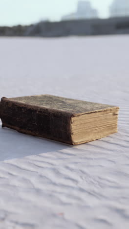 an old book on a white surface