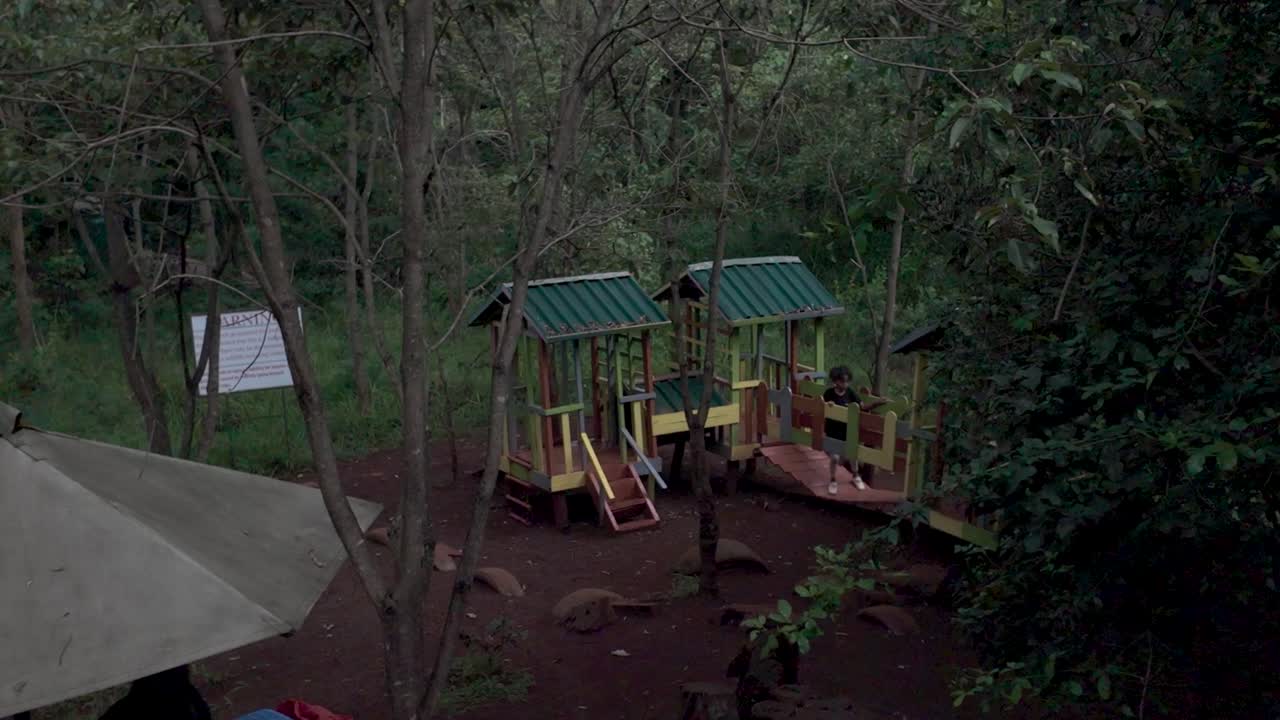 Kids playing in a Quiet Playground Amidst the Woods in a park or forest