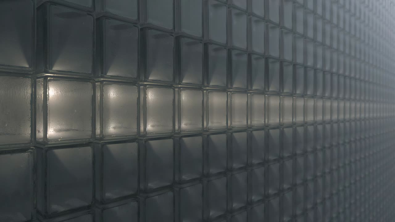 Activating rounded light at right edge, band of glass blocks glowing inside and casting haze glare