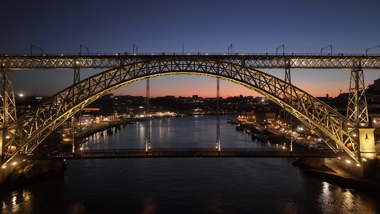 Sunset Dom Luis I Bridge At Porto In District Of Porto Portugal. Sunset Skyline Scene. Illuminated Bridge Landscape. Dom Luis I Bridge At District Of Porto Portugal. Railroad Transport