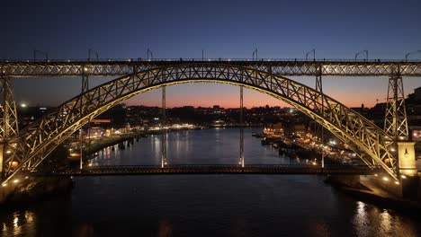 sunset dom luis i bridge at porto in district of porto portugal. sunset skyline scene. illuminated bridge landscape. dom luis i bridge at district of porto portugal. railroad transport
