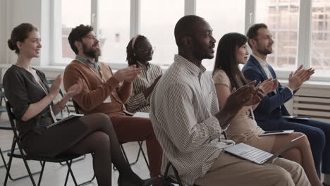 multiethnic men and women clapping hands