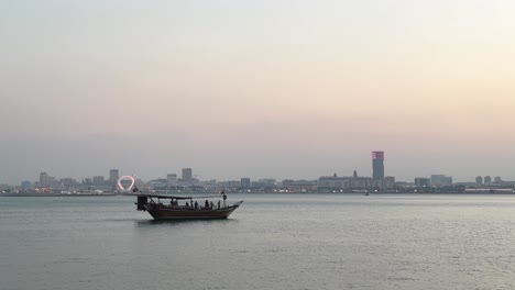 marina tourist vehicle at the corniche beach in doha qatar used for fishing and tour arabian culture traditional local people skill made dhow sailing boat wooden material ancient design sea transport